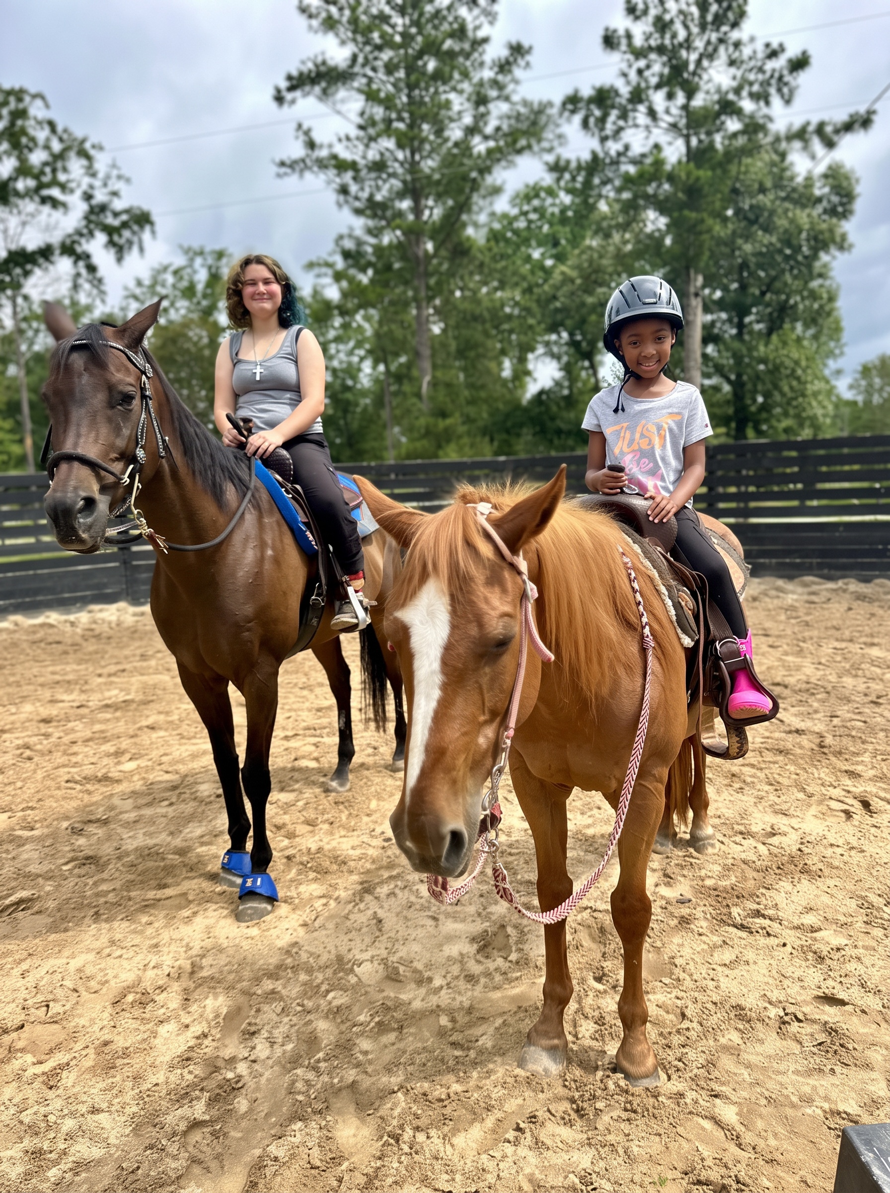 Two students on their horses, all smiles after a lesson at Horse Ridge Farm